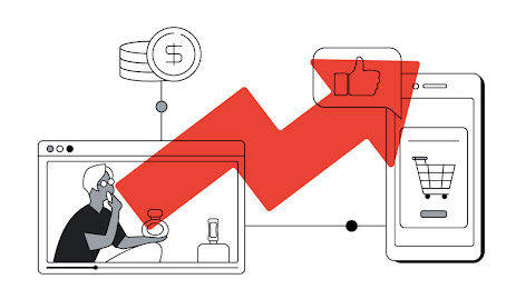 Una pareja sentada en un sillón mira contenido multimedia en una tablet.